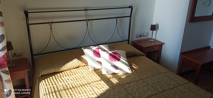 Camera Erica - dettaglio testiera del letto in ferro battuto